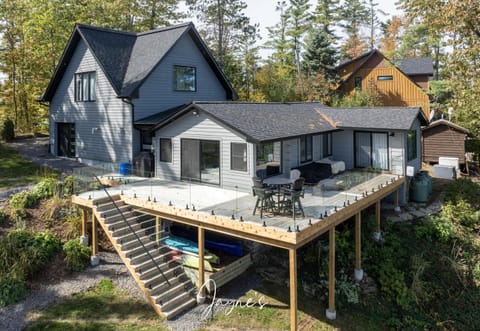 Spacious deck retreat with panoramic forest views and cozy living area