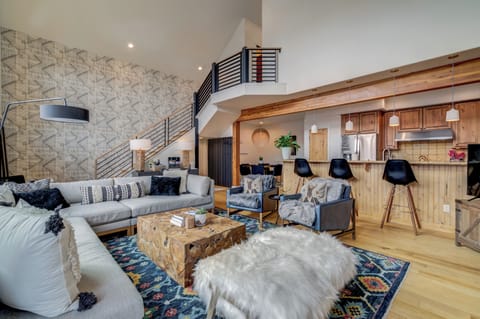 Escape Chalet great room is open concept kitchen, dinning, and living room.