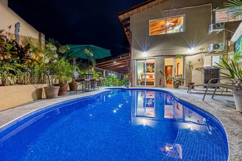 Beautifully lit pool at night — perfect for a quiet evening swim under the stars