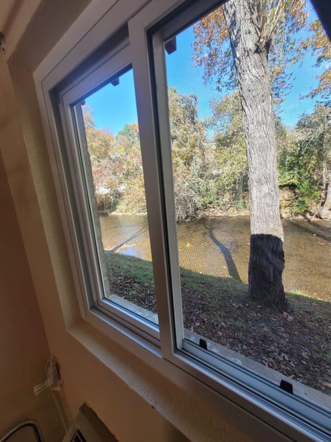 Desk, laptop workspace, blackout drapes, iron/ironing board