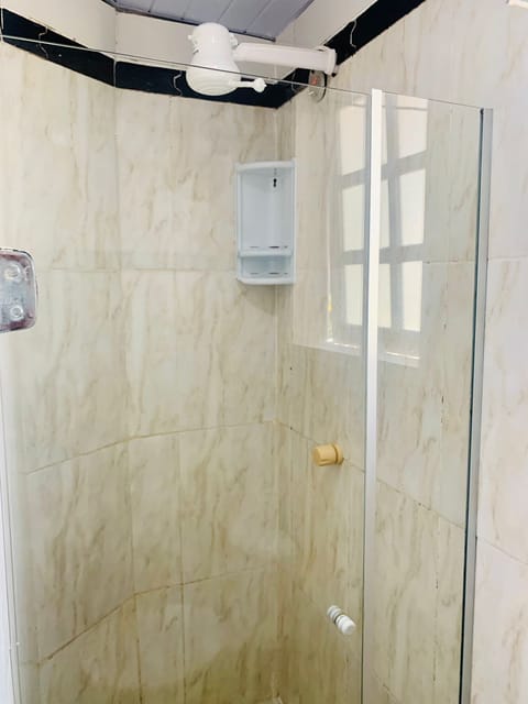 Economy Triple Room | Bathroom | Shower, towels