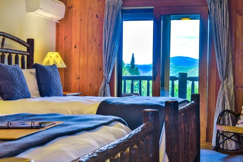 Log House Balcony Two Queens | Down comforters, individually furnished, free WiFi, bed sheets
