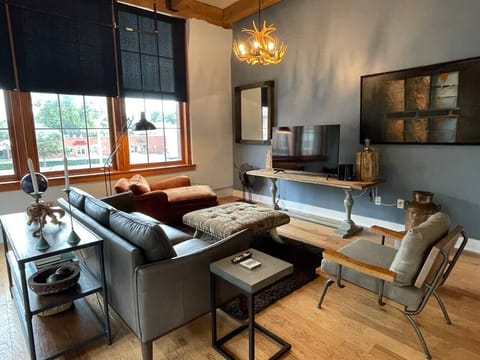 Loft living room area surrounded by extra-large windows