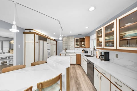 Kitchen island also has extra seating along with counter space