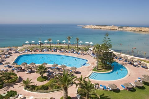 Indoor pool, outdoor pool, pool umbrellas, sun loungers