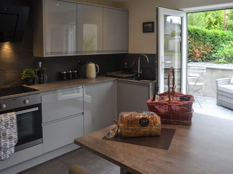 Modern, well equipped kitchen with patio doors | Pen Parc, Bryncrug, near Tywyn