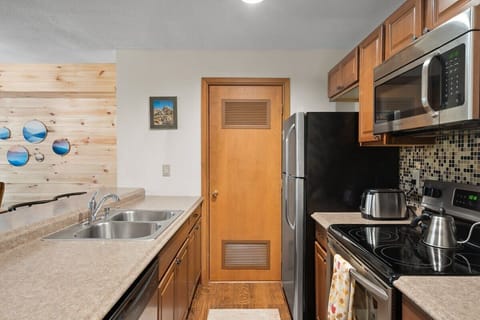 Kitchen with stainless steel appliances.