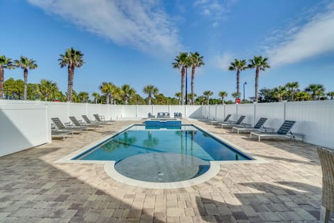 Dive into your private oasis surrounded by swaying palms and endless blue skies in this beautifully designed pool area.