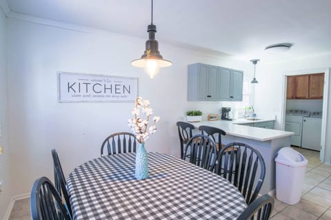 To access the back porch, use the back door located in the laundry room off of the kitchen.