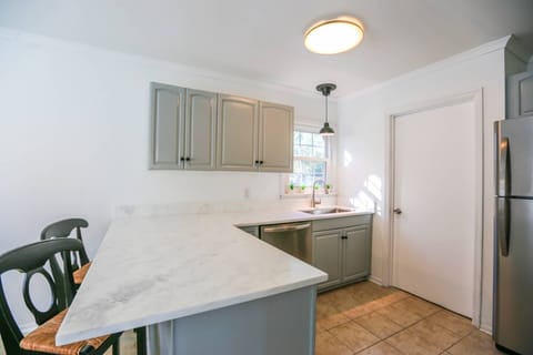 This door in the kitchen takes you to the laundry room and back door to the deck and backyard.