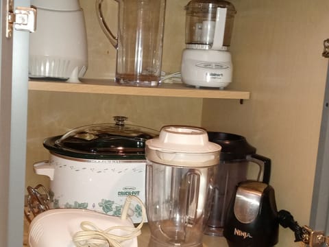 Crock Pot, blender, chopper, and a mixer.  Hot water pot and a pitcher for tea.