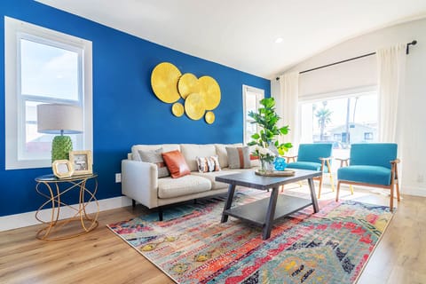 The living room with multiple windows, very bright, natural light.