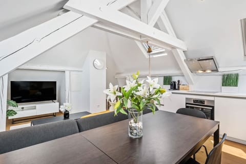 Modern simplicity at its finest - dine in style under the charm of sloped ceilings.