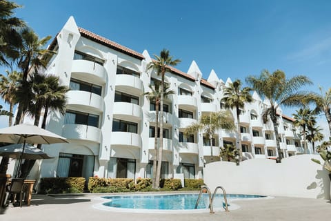 Outdoor pool, open 10:00 AM to 10:00 PM, free cabanas, pool umbrellas