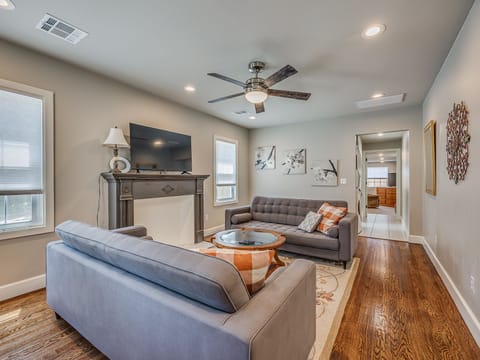 Inviting living room with ample seating and smart TV