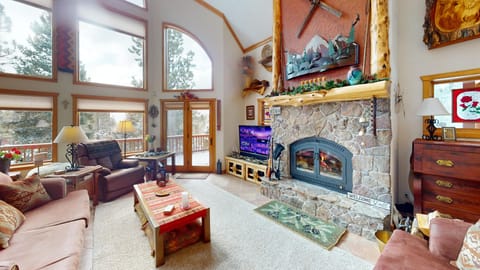 Family room with large fireplace and beautiful mountain views