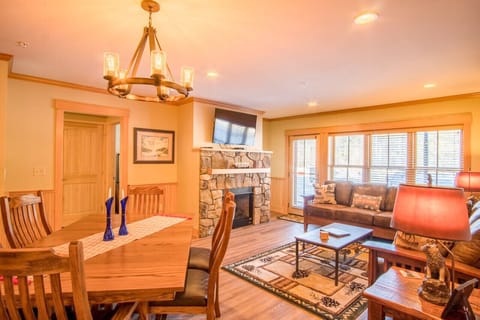 Our living room, dining area, and kitchen blend together seamlessly to create a warm and inviting space that`s perfect for entertaining.