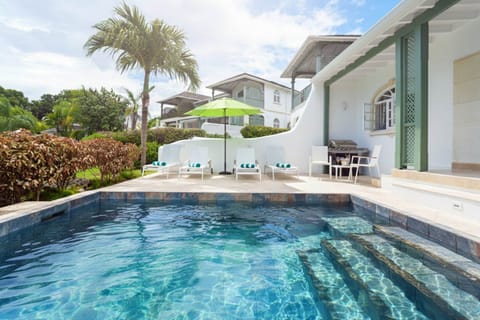 Lovely plunge pool and deck with comfortable loungers and umbrella