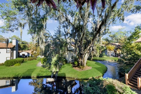 View from Balcony – Harbour Oaks 316, St. Simons Island - Gorgeous lagoon and oak canopy view from the private balcony at Harbour Oaks 316. A peaceful, scenic backdrop for your St. Simons Island vacation.