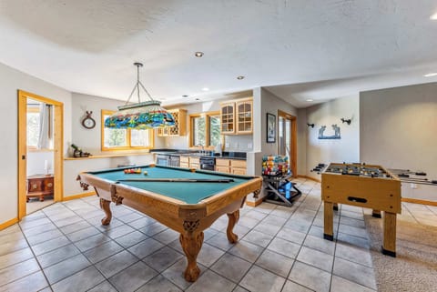 Game Room: Pool table, foosball, full wet bar, poker table, plush furnishings, gas fireplace, Roku TV