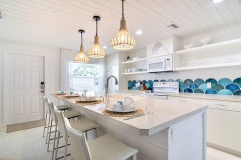 Fresh, bright open floor plan with new tongue and groove ceilings with kitchen skylight.