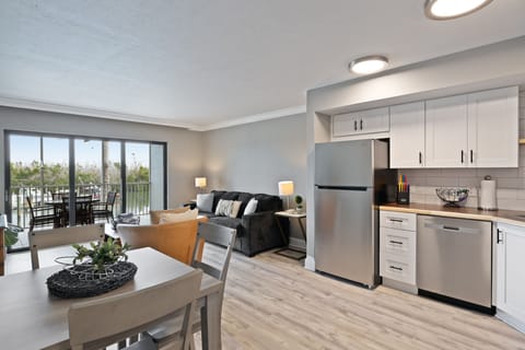 Expansive living room with full kitchen overlooking marina
