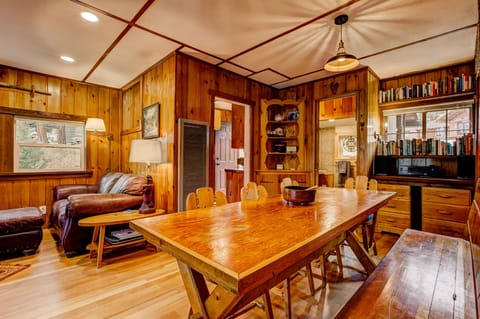 Open living space, large dining table and restored 100 year old wood floors.