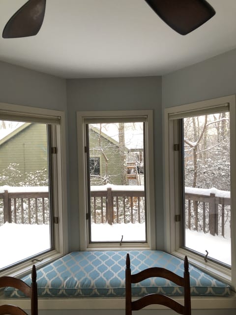 Bay Window w/ seating nook in dining room overlooking porch.