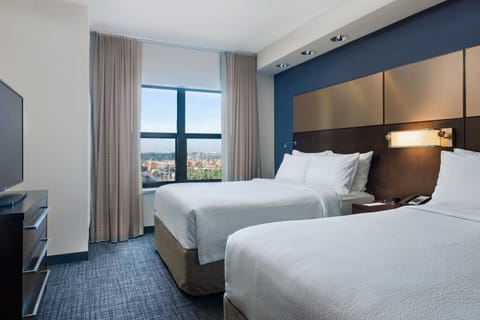 Premium bedding, desk, iron/ironing board, free cribs/infant beds