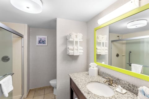 Shower, designer toiletries, hair dryer, towels