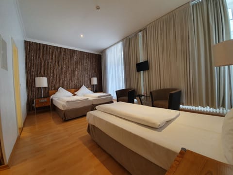 Triple Room | Living area | Flat-screen TV