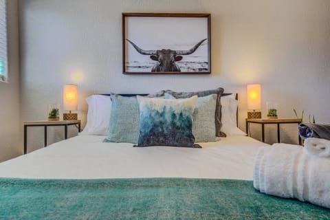 Queen Bedroom: Stylish decor and serene colors invite relaxation after your adventures!