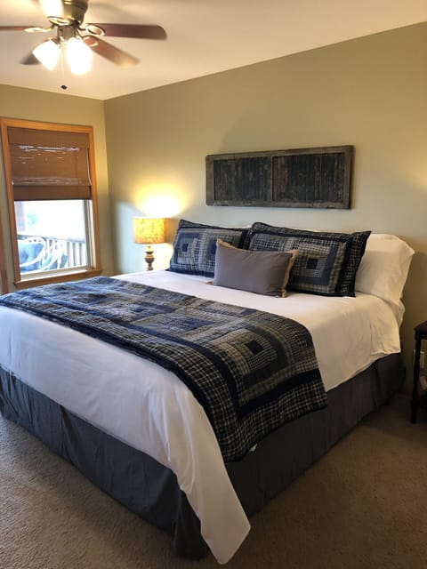 Master Bedroom with King bed, private deck access and jacuzzi tub