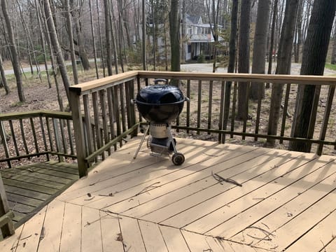 Charcoal grill on grilling deck. 