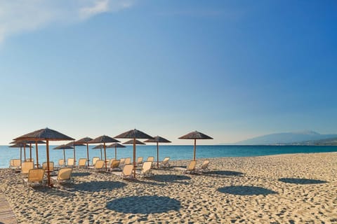 Private beach, white sand, sun loungers, beach umbrellas