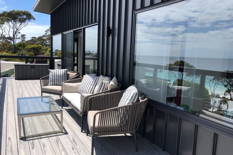 Deck has comfortable seating, and a WeberQ BBQ