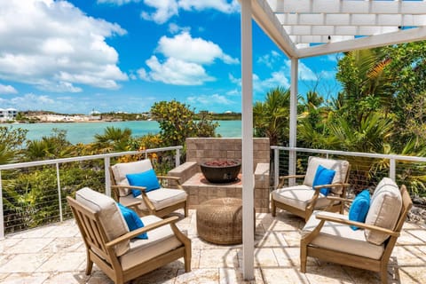 The patio with fire pit is the perfect spot to enjoy the water views every evening.