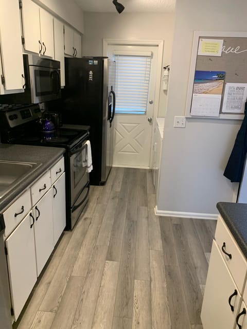 Fully stocked kitchen with full size washer and dryer.