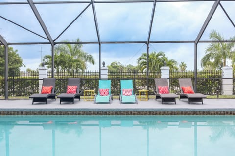 Relax poolside in provided loungers