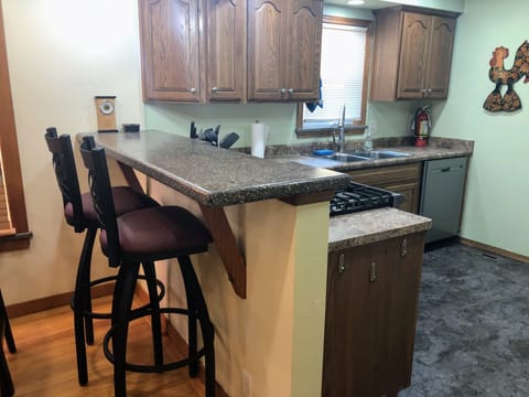 Bar with two sturdy barstools.