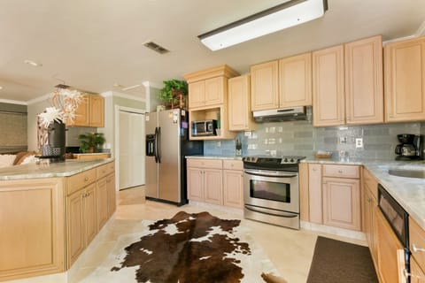 Suite, 2 Bedrooms | Private kitchen | Full-size fridge, microwave, stovetop, dishwasher