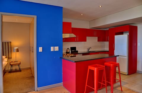 One Bedroom Apartment | Private kitchen | Coffee/tea maker, highchair, cleaning supplies