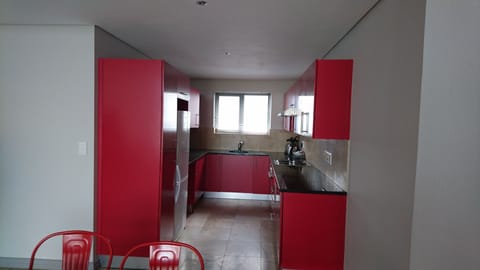 Three Bedroom Apartment | Private kitchen | Coffee/tea maker, highchair, cleaning supplies