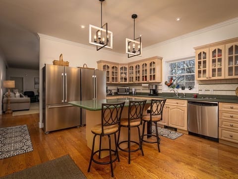 Two refrigerators, eat in seating at the island