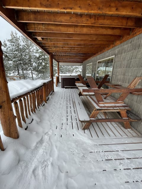 Side deck with picnic tables and hot tub