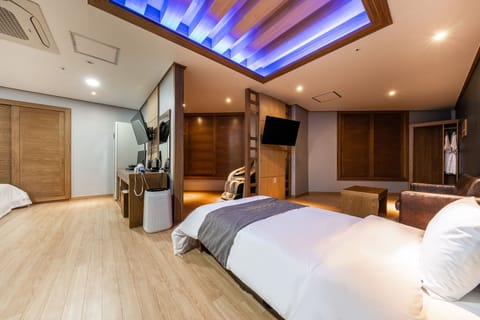 Premium Triple Room (Styler + Air Purifier + Massage Chair) | Premium bedding, down comforters, free minibar, individually furnished