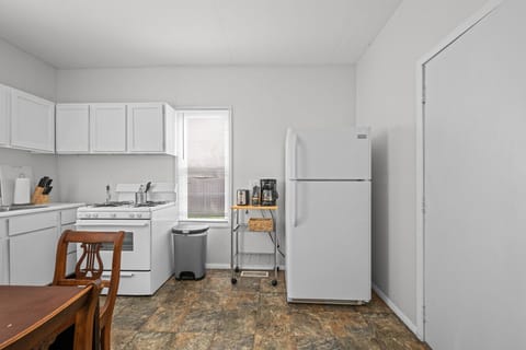 Start your mornings right with a cozy kitchen setup featuring a coffee maker, toaster, and everything you need for quick bites.