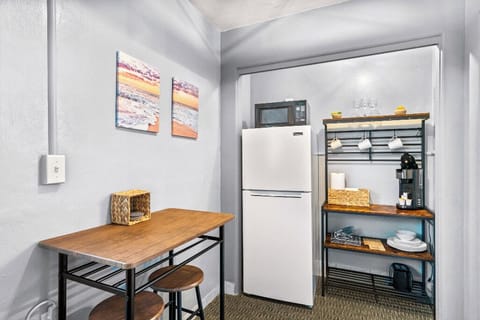 Boutique Beach Retreat open concept kitchenette, refrigerator/freezer, coffee bar, with kitchen basics, and seating area