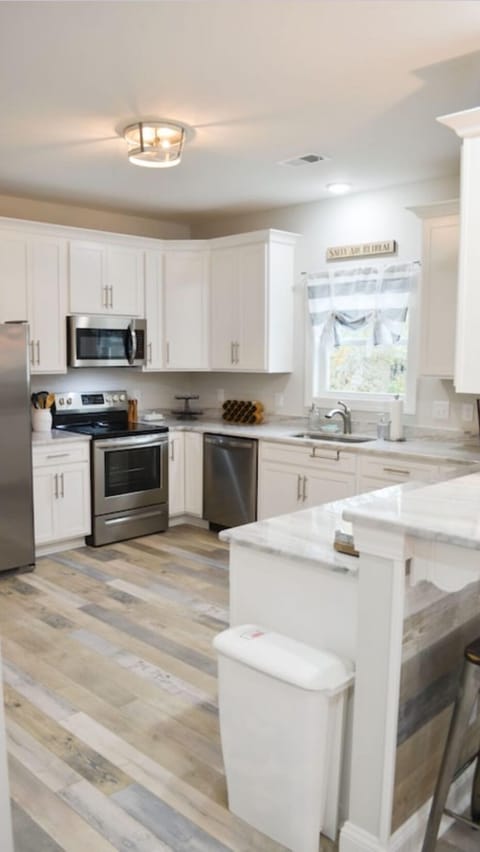 The kitchen has granite countertops and stainless steel appliances!