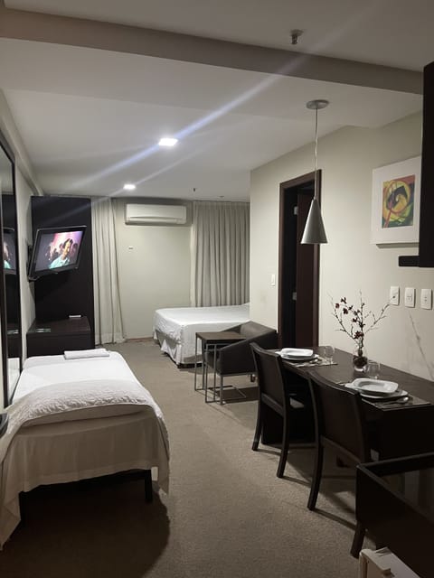 Standard Triple Room | Minibar, in-room safe, desk, blackout drapes